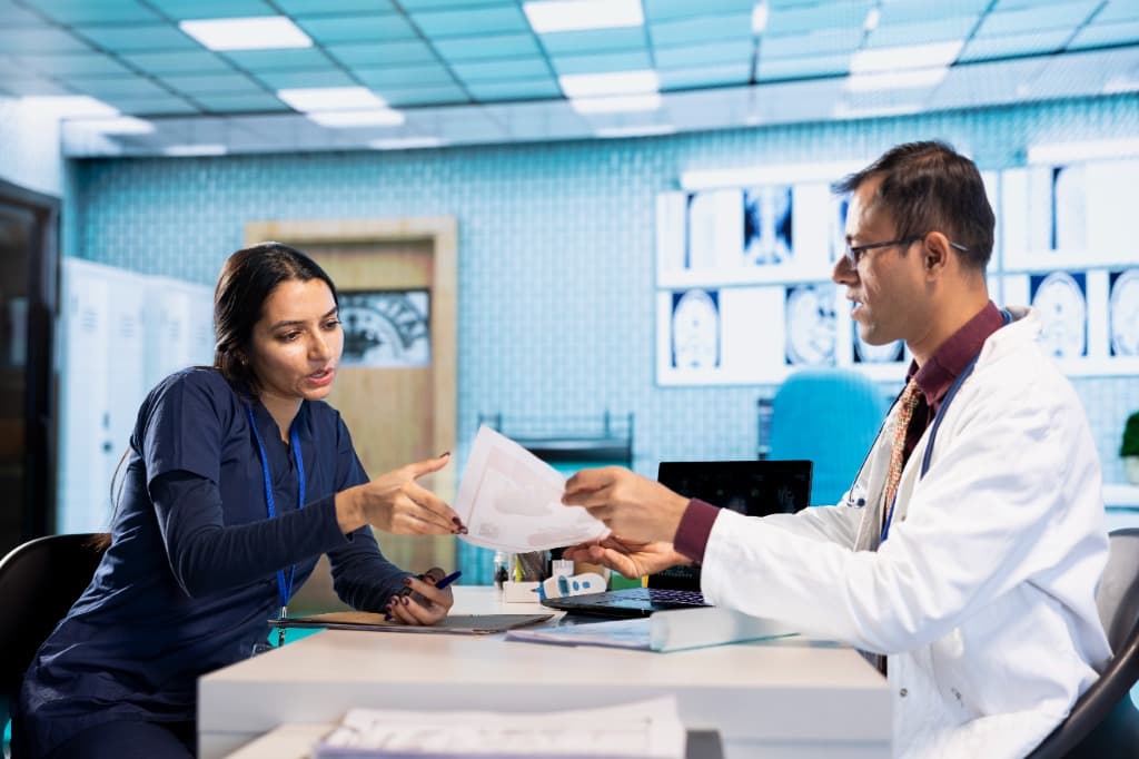 Doctor and Healthcare Operations Specialist Reviewing Claims
